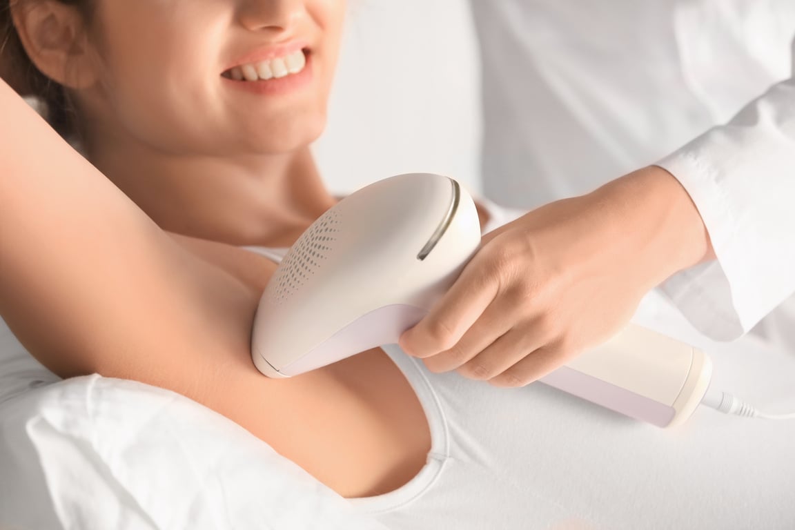 Young Woman Undergoing Laser Hair Removal for Her Underarm 